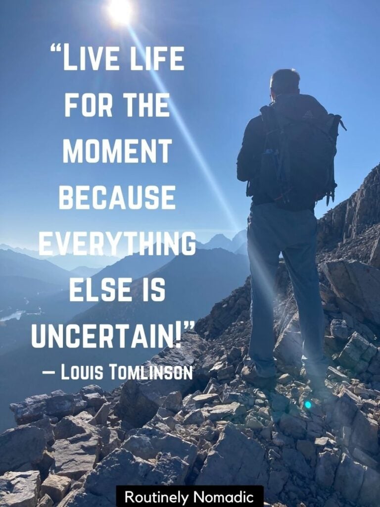 Hiker looking at mountains with deep quotes about enjoying every mement by Tomlinson