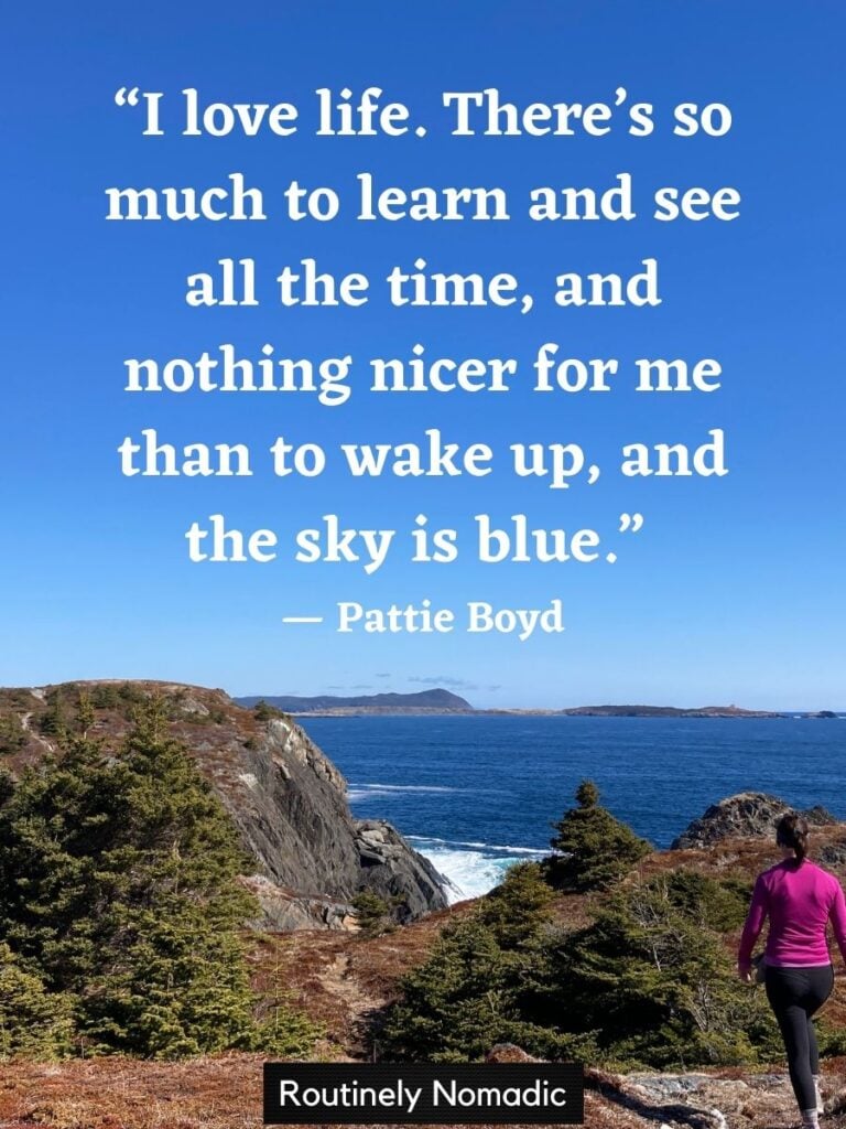 Person hiking with I love life quotes by Boyd